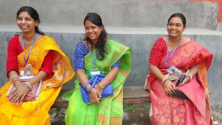 In a different picture, three candidates of the ruling opposition party celebrating at the voting ceremony at the election booth