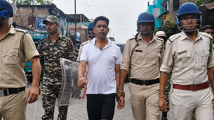Jahangir, clad in shorts, was taken through the streets of Falta under a heavy police cordon; the incident was reconstructed at his home and party office.